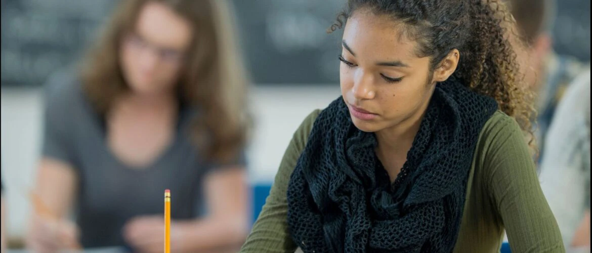 GrowthPro Learning: Student saying calm while writing her exam